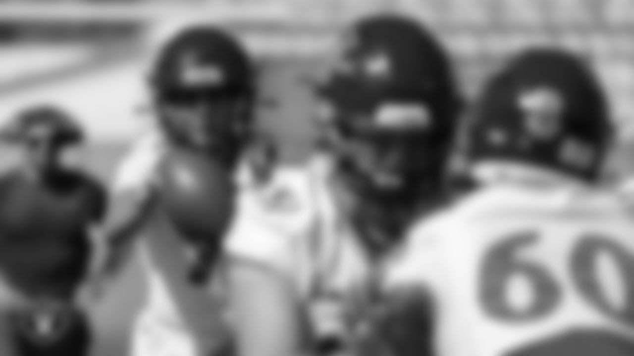 Members of the Arbor View High School football team go through a play during practice at Arbor View High School.