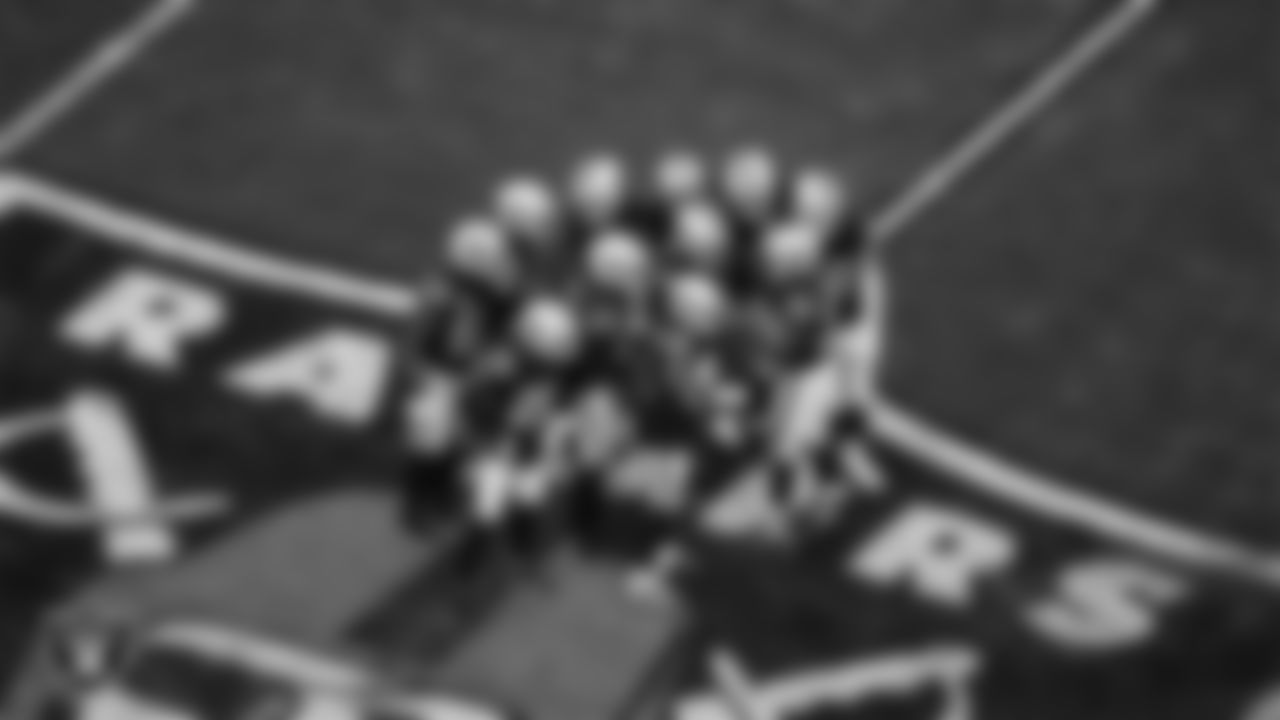 The Las Vegas Raiders defense huddles during the regular season home game against the Los Angeles Chargers at Allegiant Stadium.