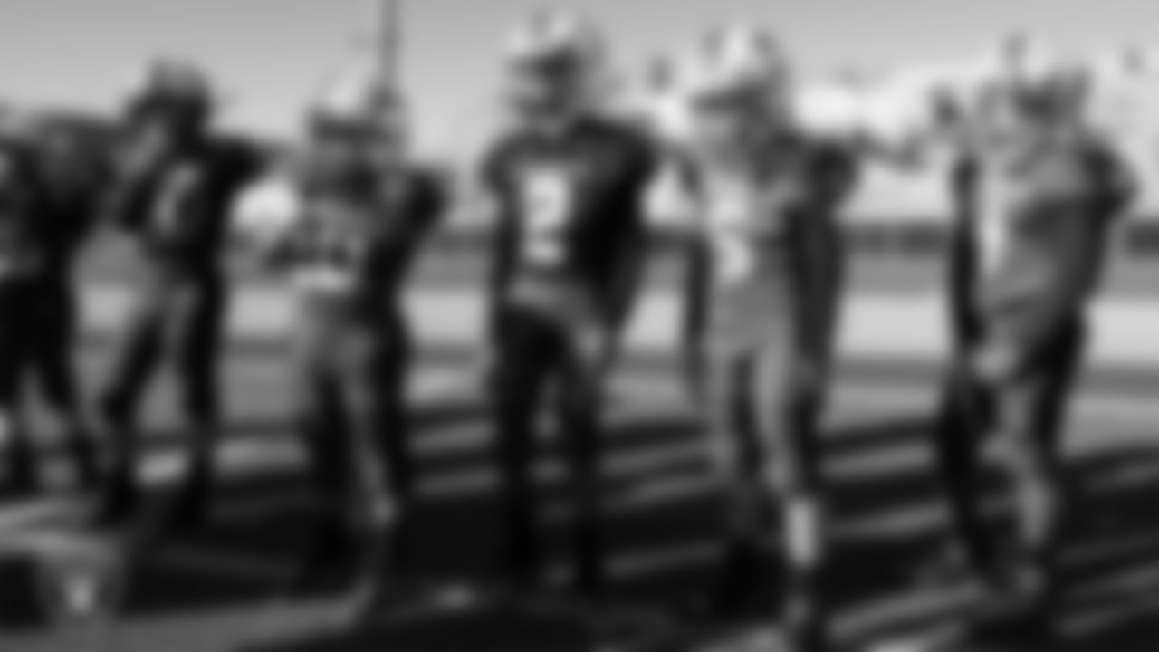 Players from the Henderson Cowboys team stand on the sidelines during the American Youth Football & Cheer Regional Championships at Del Sol High School.