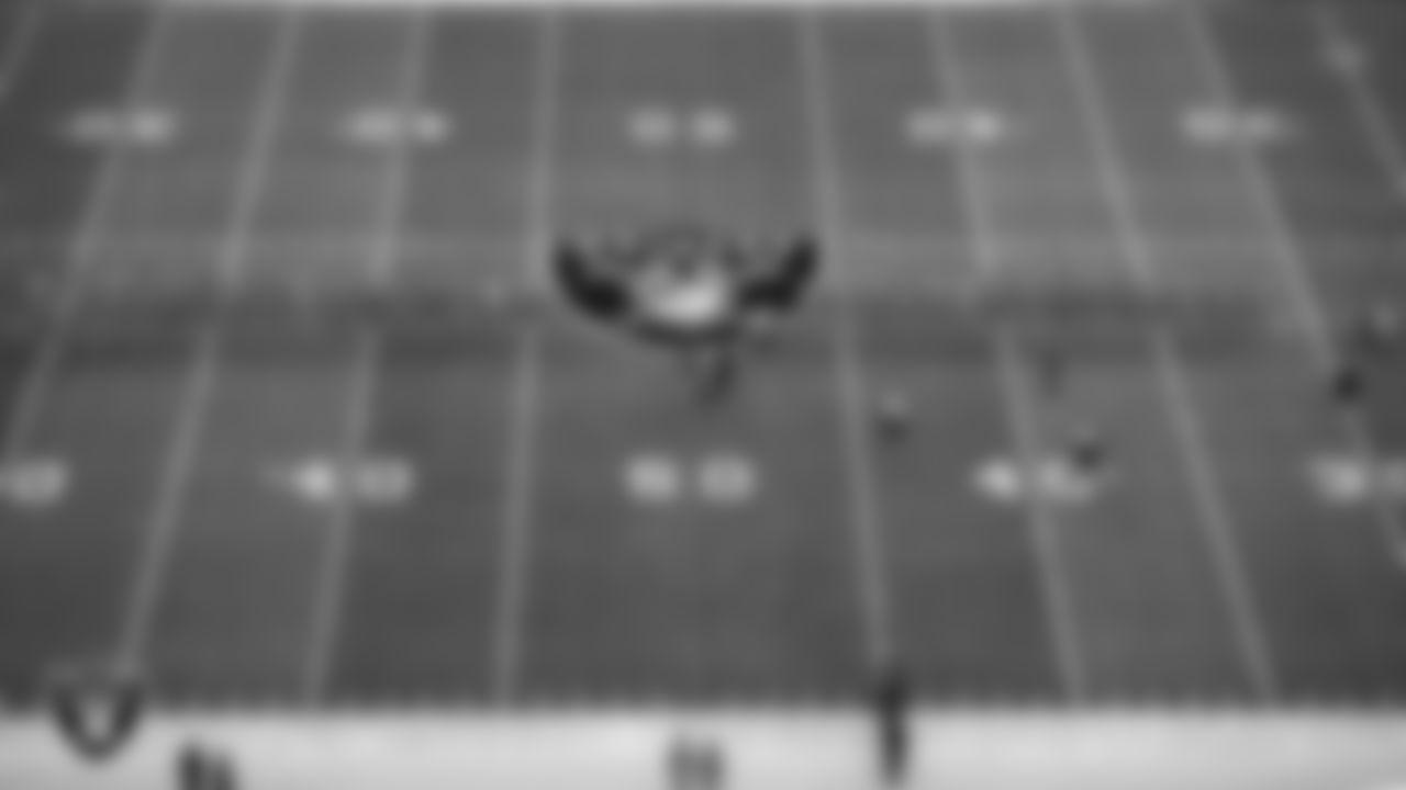 Members of the United States Air Force take part in a reenlistment ceremony before the Las Vegas Raiders' regular season home game against the Cincinnati Bengals.