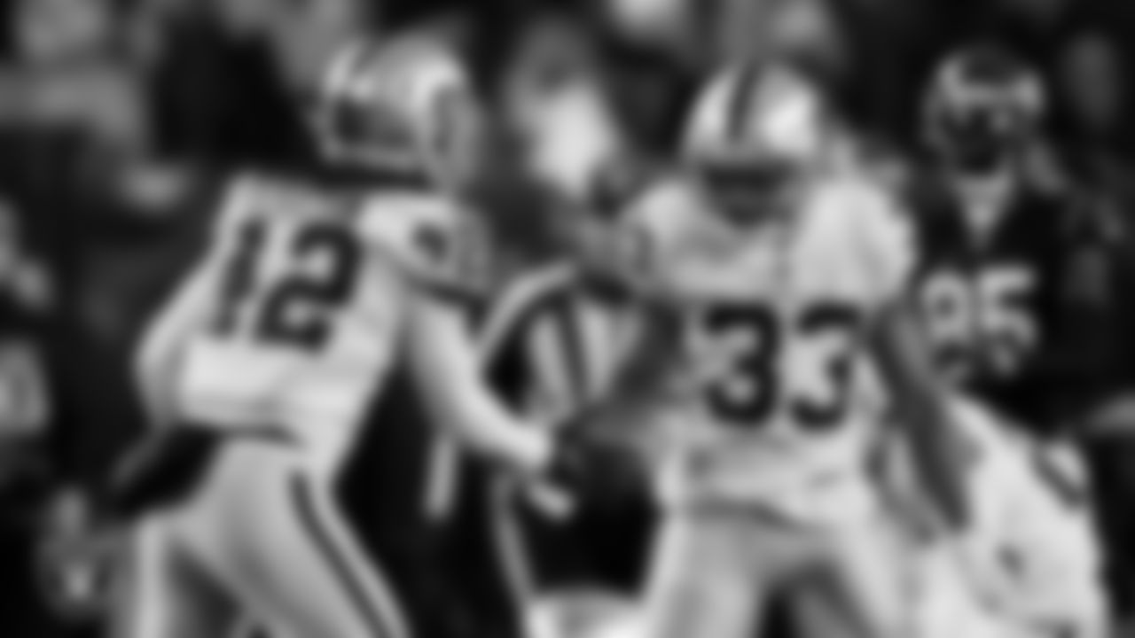 Las Vegas Raiders linebacker Cory Littleton (42) and safety Roderic Teamer (33) celebrate after a stop during the postseason away game against the Cincinnati Bengals.