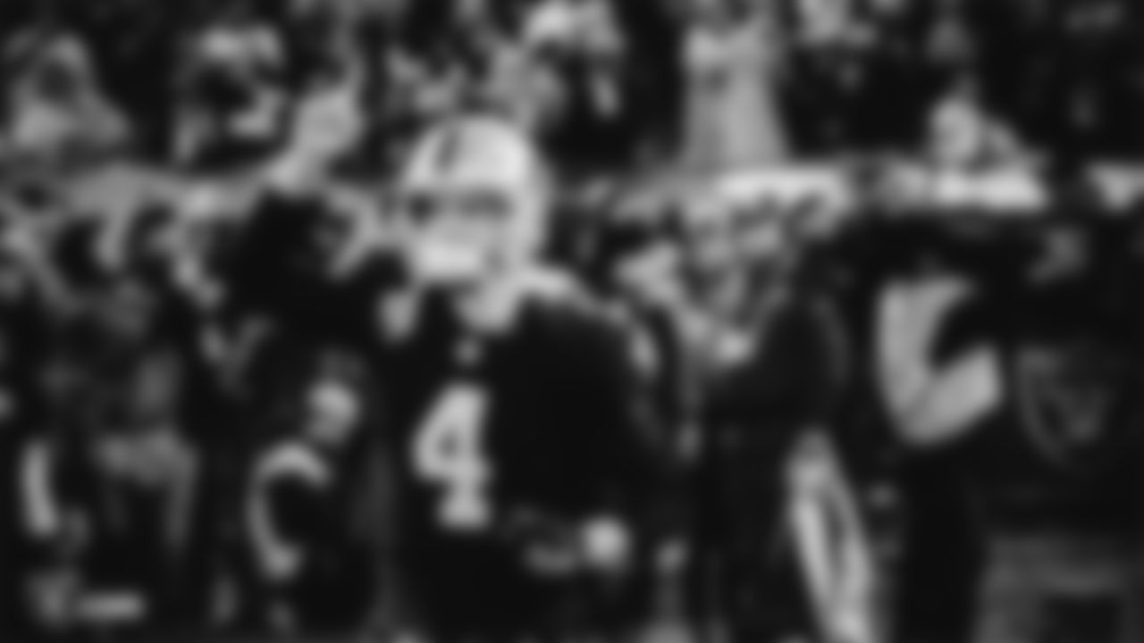 Oakland Raiders quarterback Derek Carr (4) is introduced onto the field before the Oakland Raiders regular season game against the Denver Broncos at Oakland-Alameda County Coliseum, Monday, December 24, 2018, in Oakland, California. The Oakland Raiders won 24-17.