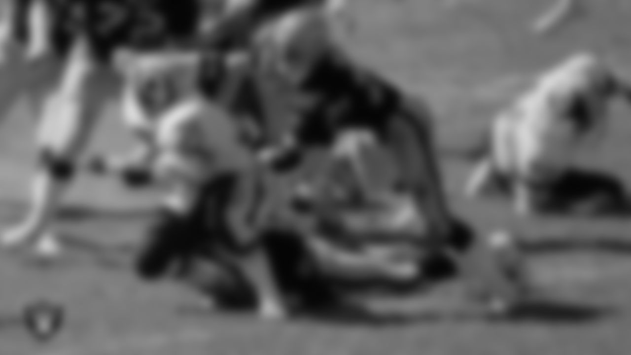 Oakland Raiders defensive end/defensive tackle Dave Browning (73) makes a tackle during the regular season home game against the Washington Football Team at the Oakland–Alameda County Coliseum, Sunday, September 21, 1980, in Oakland, Calif.