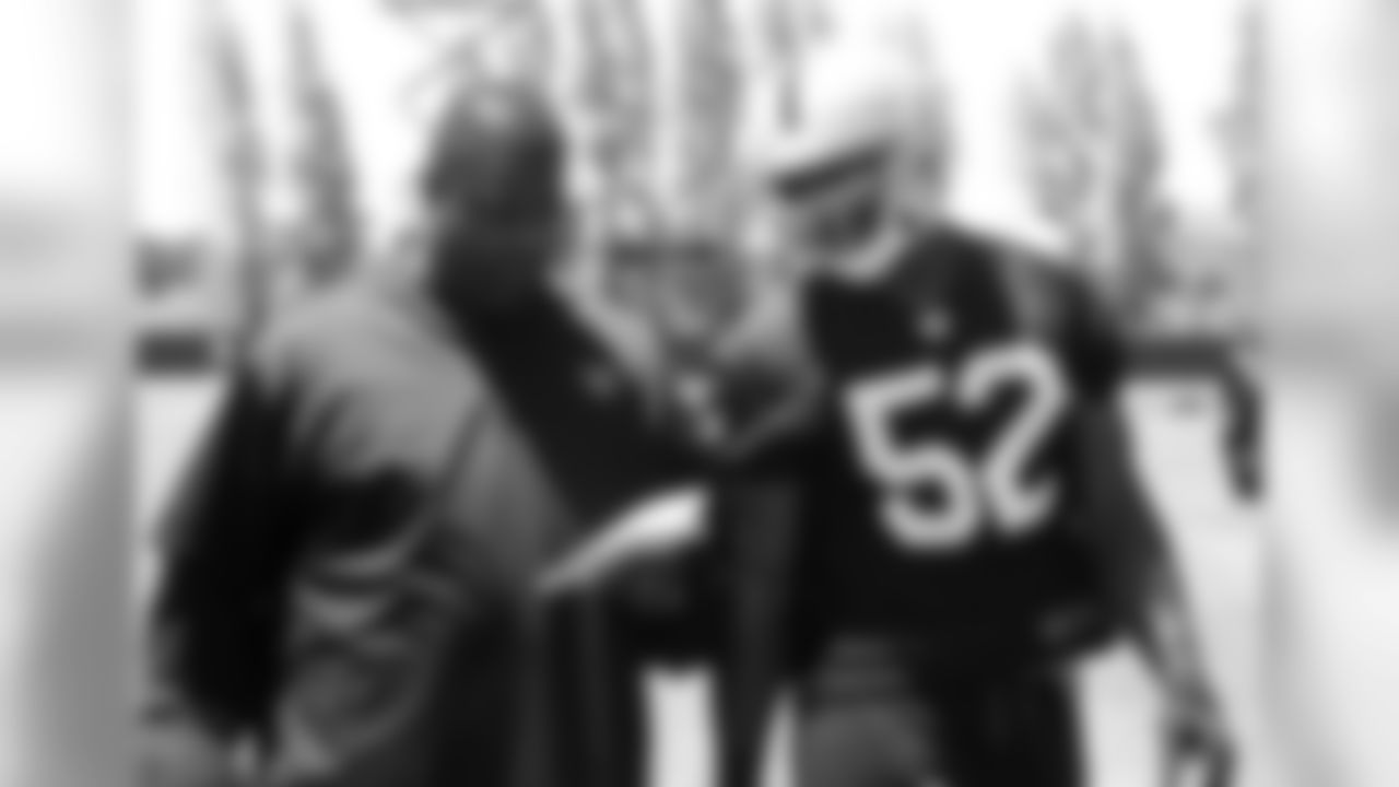 LB Khalil Mack gets coached up by defensive line coach Terrell Williams.