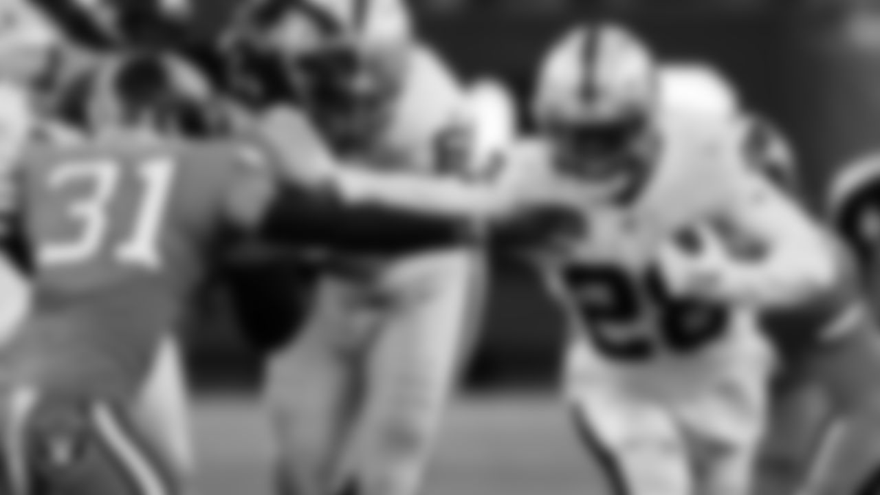 Las Vegas Raiders running back Josh Jacobs (28) rushes the quarterback during the regular season away game against the Denver Broncos at Empower Field at Mile High.