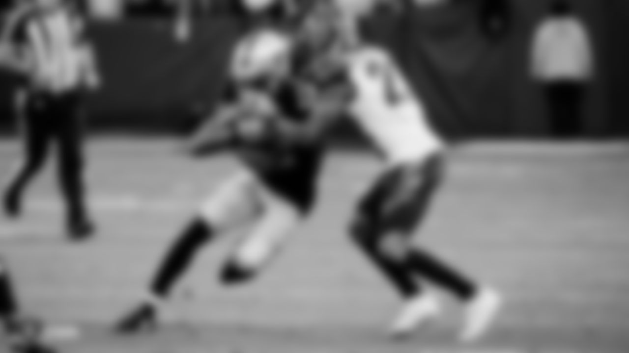 Raiders wide receiver Zay Jones (12) runs after making a catch during the regular season game against the Cincinnati Bengals.