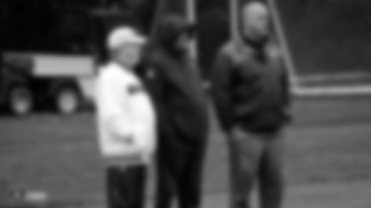 Raiders Owner Mark Davis, alumni George Atkinson and Steve Wisniewski the field for practice at The Grove Hotel.