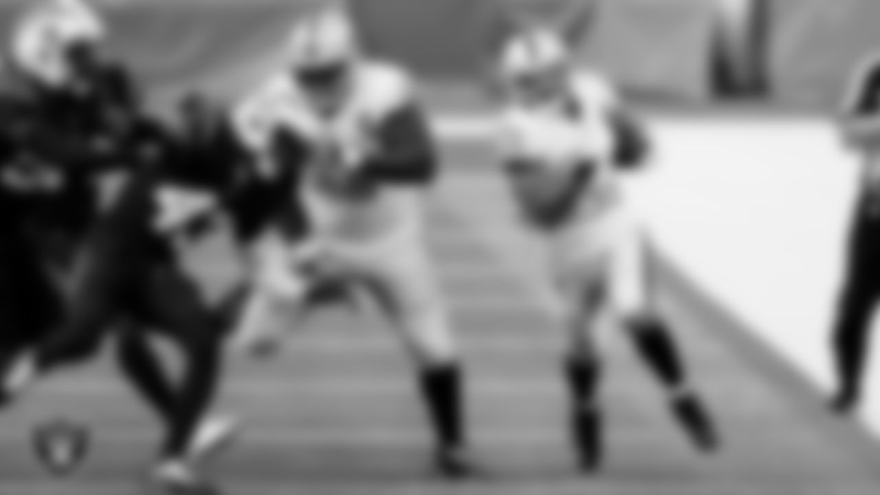 Las Vegas Raiders center Rodney Hudson (61) blocks as running back Devontae Booker (23) rushes during the regular season away game against the Los Angeles Chargers.