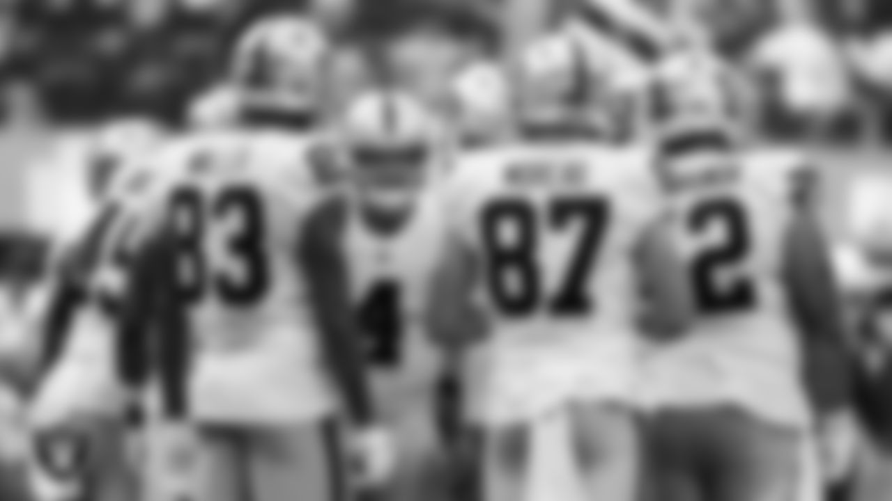 The Las Vegas Raiders offense huddles during the regular season away game against the Los Angeles Chargers at SoFi Stadium.