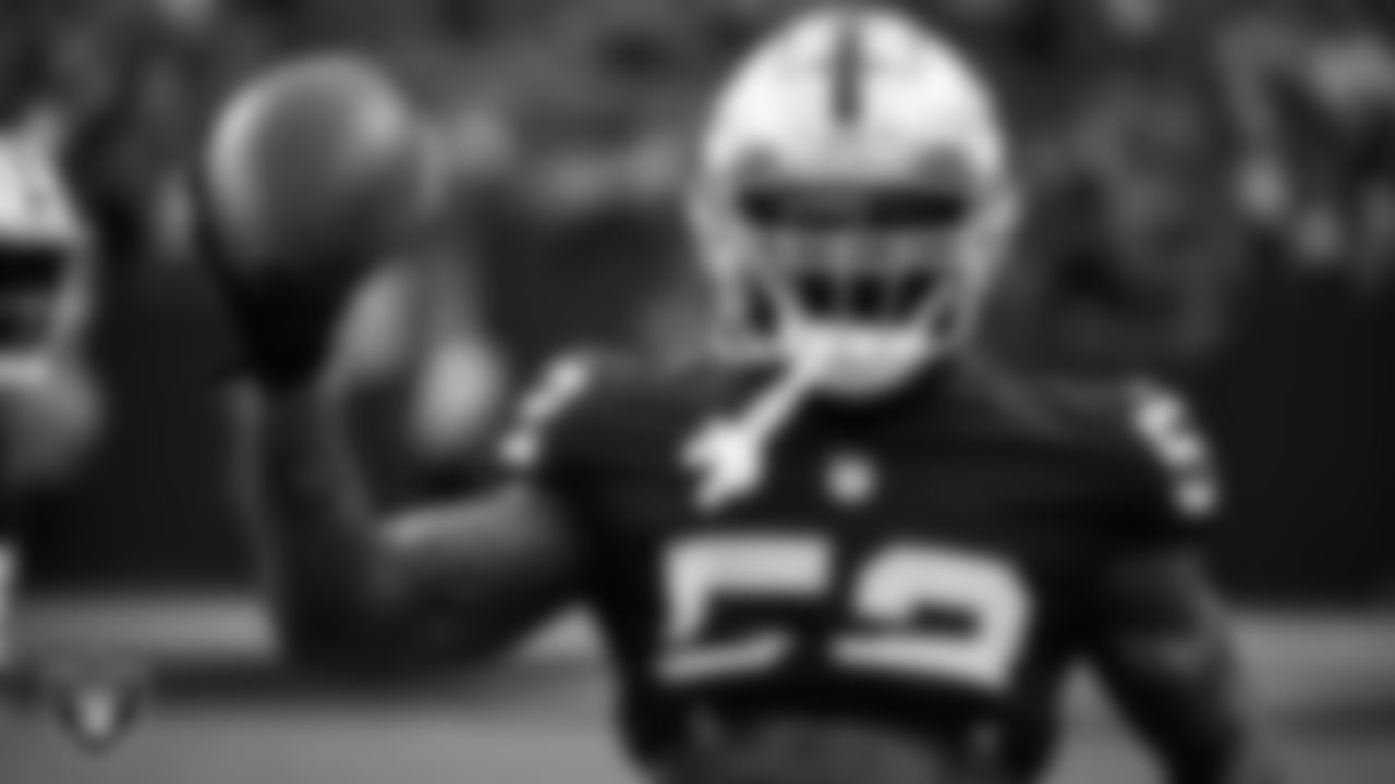 Las Vegas Raiders linebacker Denzel Perryman (52) warming up before the preseason home game against the New England Patriots at Allegiant Stadium.