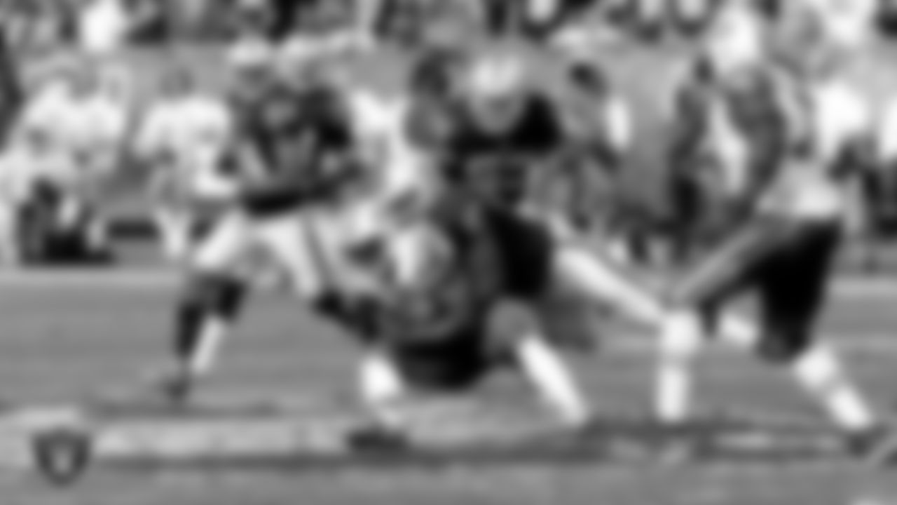 Raiders defensive end Mario Edwards Jr. (97) makes a tackle during the regular season home game against the New York Jets at O.co Coliseum, Sunday, November 1, 2015, in Oakland, Calif.