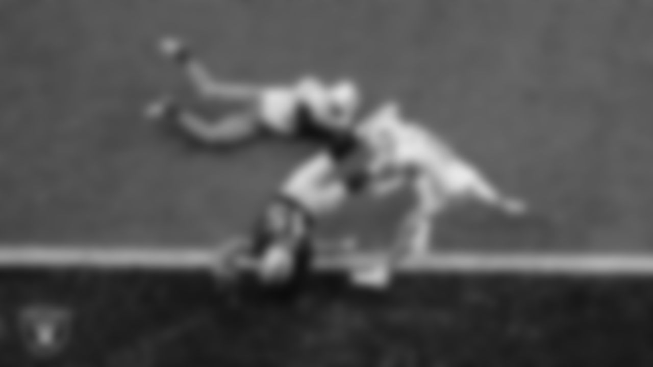 Las Vegas Raiders fullback Alec Ingold (45) dives into the end zone on a 1-yard touchdown catch during the regular season home game against the Miami Dolphins.