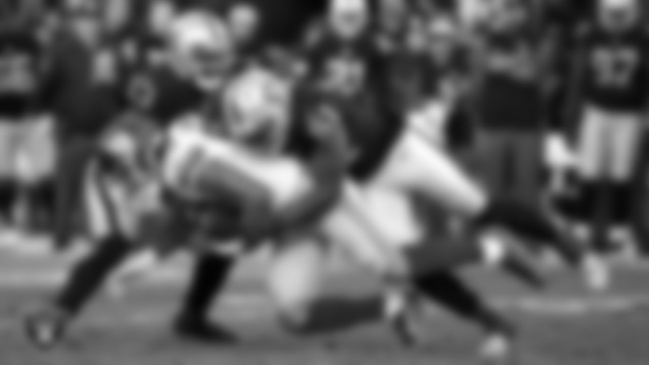Oakland Raiders linebacker NaVorro Bowman (53) and linebacker Bruce Irvin (51) make a tackle during the regular season home game against the New York Giants at Oakland–Alameda County Coliseum, Sunday, December 3, 2017, in Oakland, Calif.