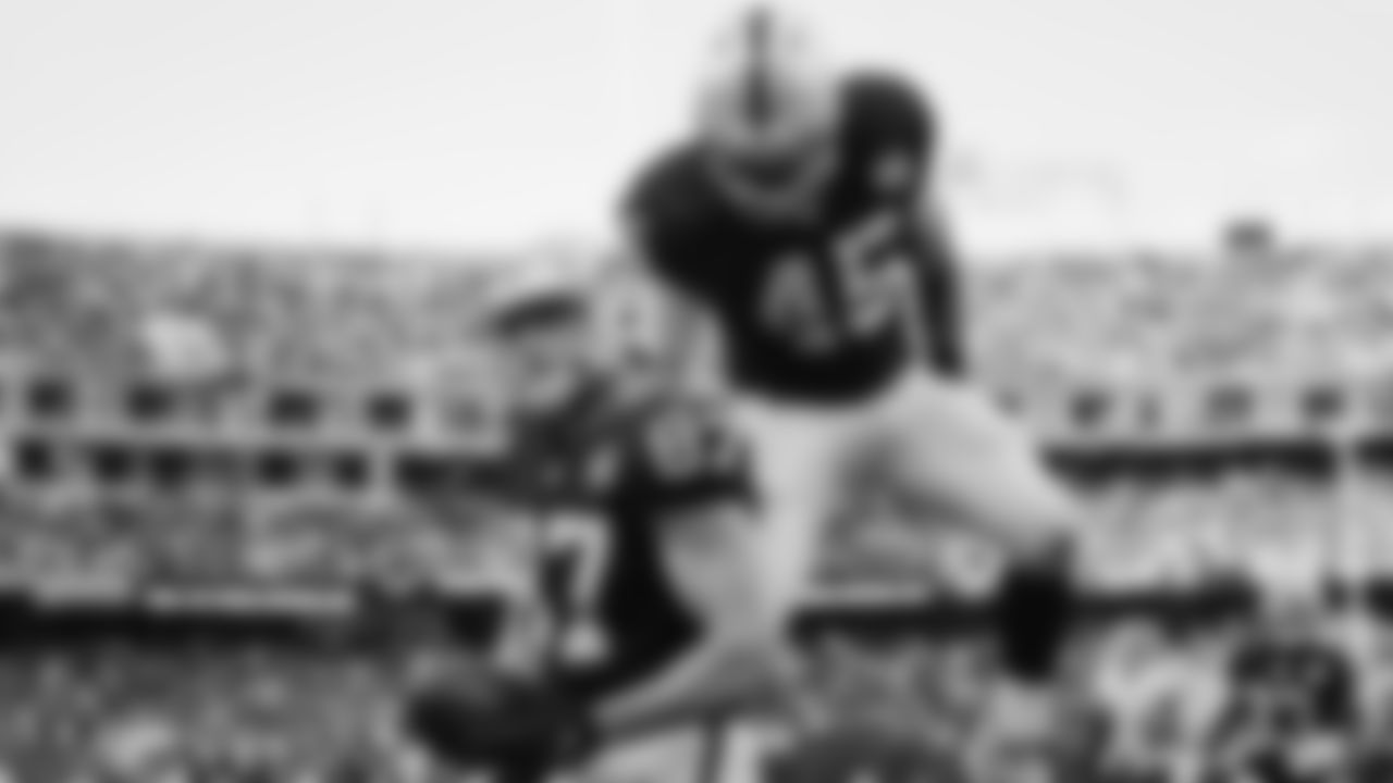 Raiders tight end Foster Moreau (87) is congratulated by fullback Alec Ingold (45) after a 1-yard touchdown catch during the regular season game against the Tennessee Titans.