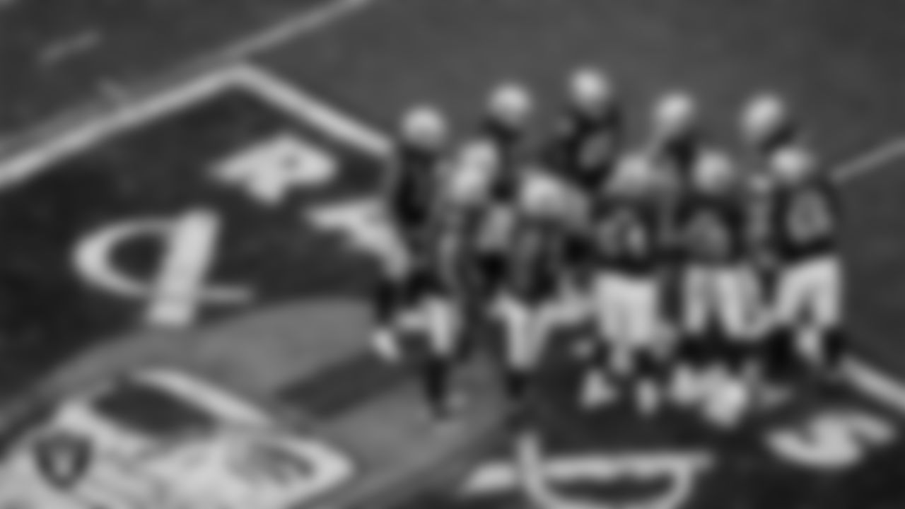 The Las Vegas Raiders offense huddles during the regular season home game against the Indianapolis Colts at Allegiant Stadium.