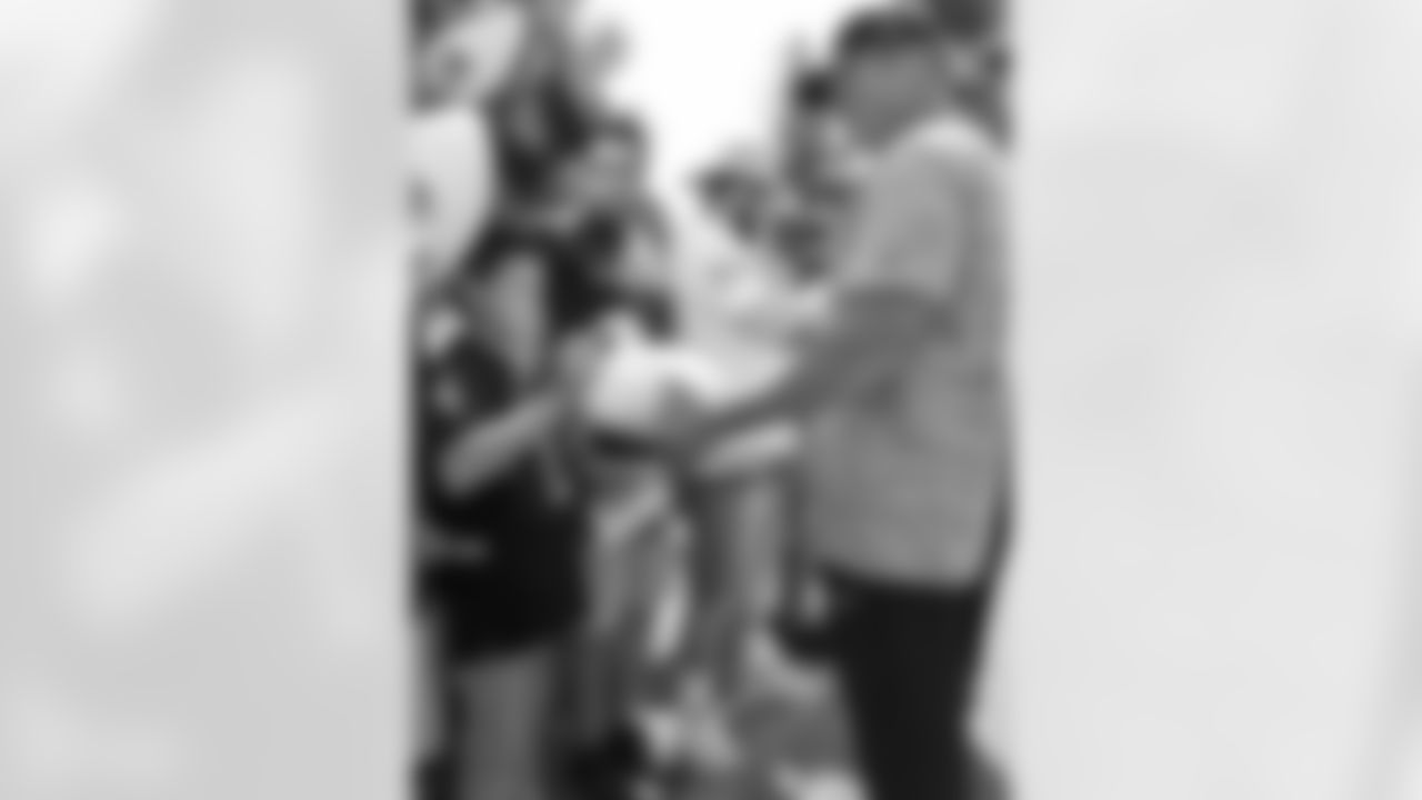 Oakland Raiders head coach Jon Gruden sign autographs for fans after practice at 2018 Training Camp at The Oakland Raiders Napa Valley Training Complex, Thursday, August 2, 2018, in Napa, California.