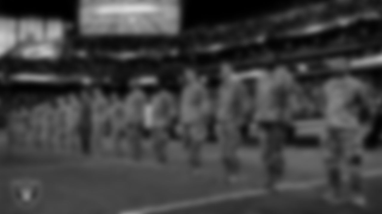 Members of the United States Air Force take part in a reenlistment ceremony before the Las Vegas Raiders' regular season home game against the Indianapolis Colts at Allegiant Stadium.