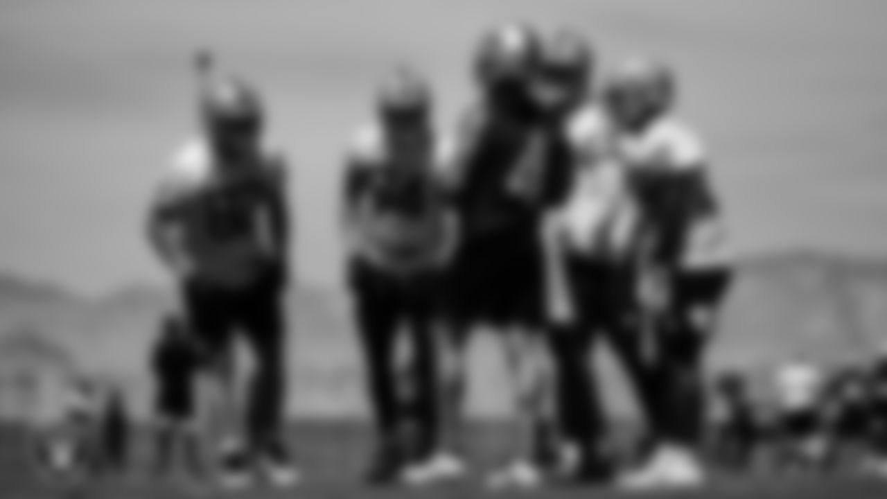 The Las Vegas Raiders huddle at an Organized Team Activity (OTA).