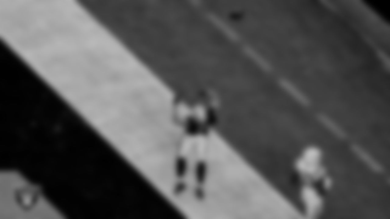 Las Vegas Raiders tight end Foster Moreau (87) celebrates after making a 47-yard touchdown catch during the regular season game against the Indianapolis Colts at Allegiant Stadium.