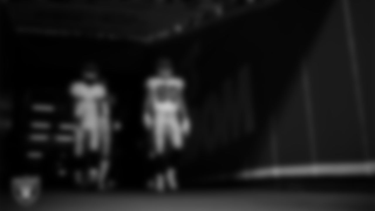 Las Vegas Raiders safety Duron Harmon (30) and tight end Jesper Horsted (80) walks down the tunnel before the regular season away game against the Kansas City Chiefs at GEHA Field at Arrowhead Stadium.