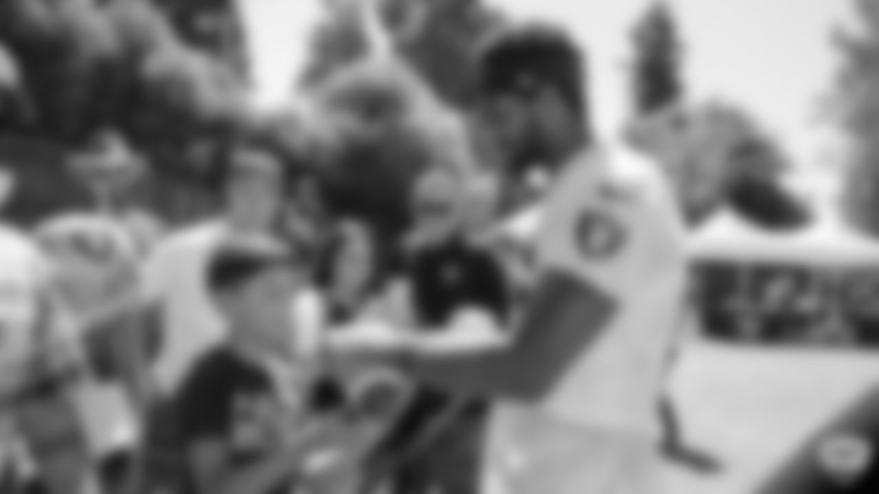 Raiders wide receiver Tyrell Williams (16) signs autographs for fans after practice at 2019 Training Camp.