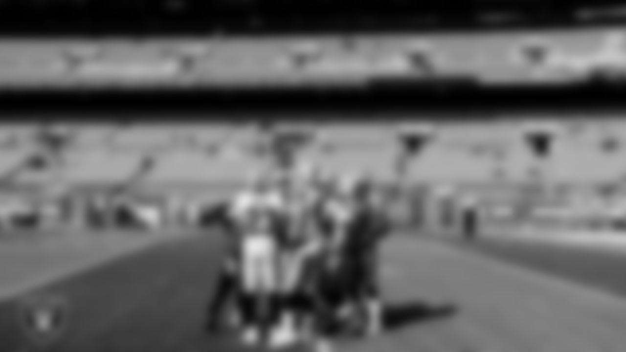 The Raiders warm up before the regular season game against the Cleveland Browns at FirstEnergy Stadium.