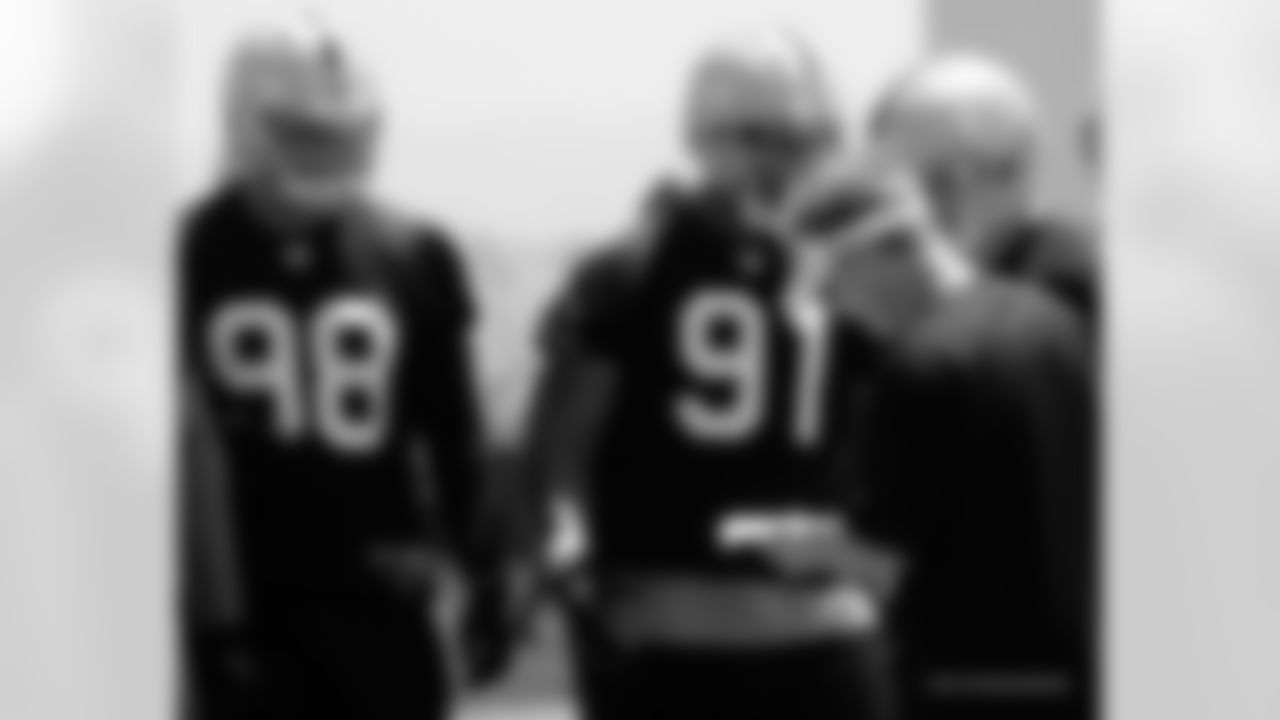 Defensive coordinator Jason Tarver with D-linemen Jamie Cumbie and Jack Crawford