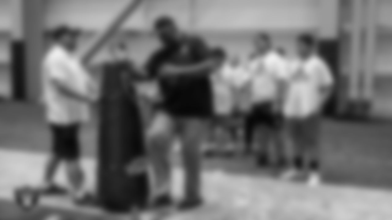 Las Vegas Raiders alumni James Harris works on a drill with an athlete during the ELITE Academy at Las Vegas Raiders Headquarters.