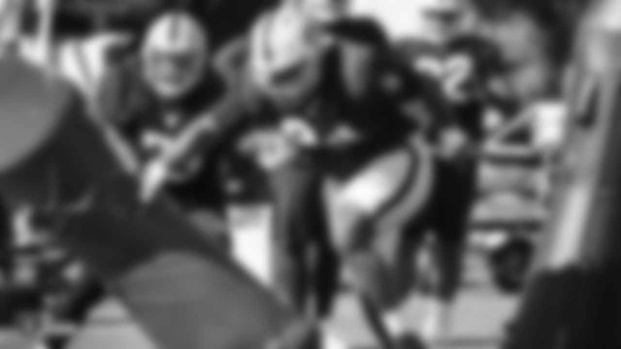 Raiders defensive tackle Corey Liuget (94) goes through defensive drills during practice.