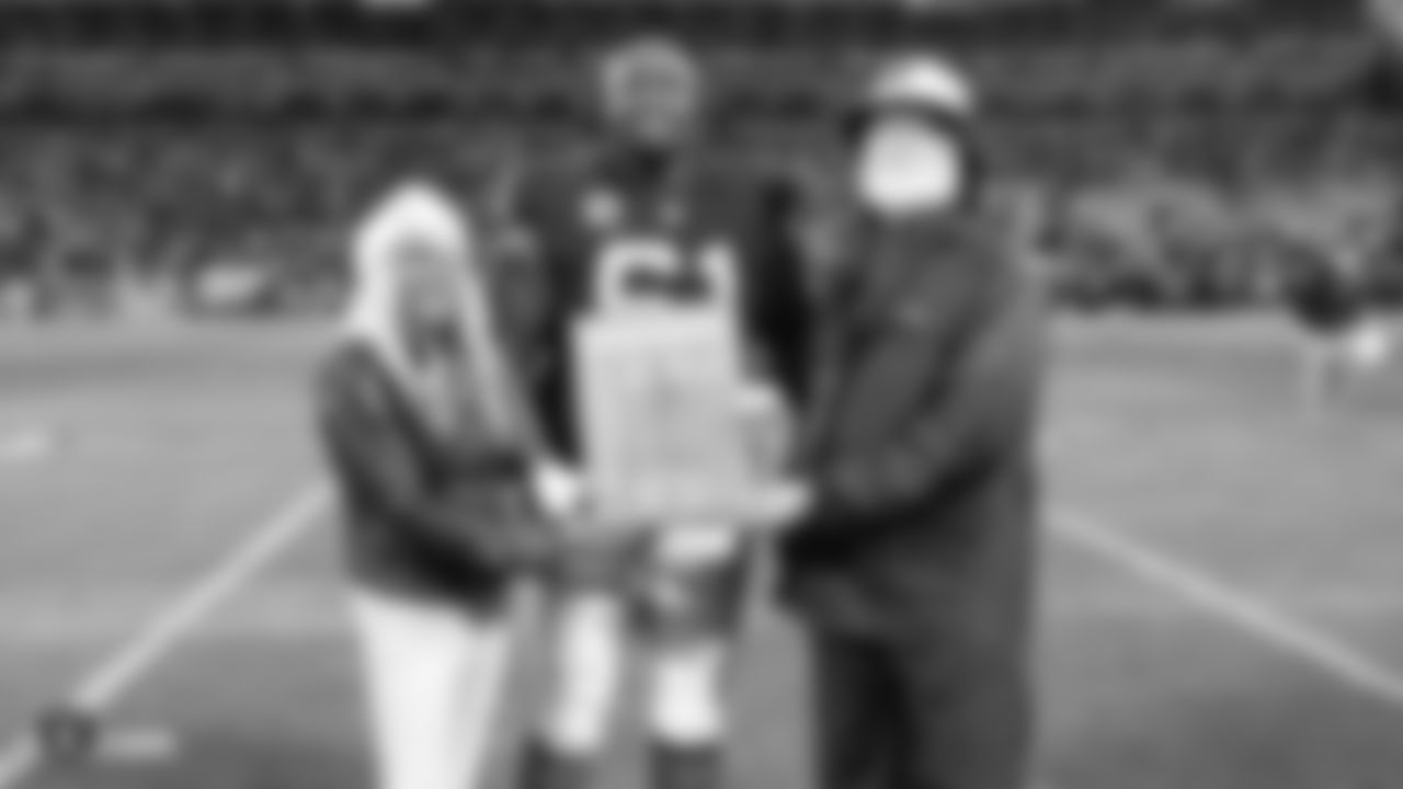 Oakland Raiders center Rodney Hudson (61) receives the Commitment to Excellence Award before the Oakland Raiders regular season game against the Denver Broncos at Oakland-Alameda County Coliseum, Monday, December 24, 2018, in Oakland, California. The Oakland Raiders won 24-17.