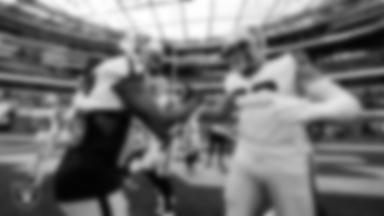 Las Vegas Raiders wide receiver Davante Adams (17) and defensive end Maxx Crosby (98) warming up before the regular season away game against the Los Angeles Chargers at SoFi Stadium.