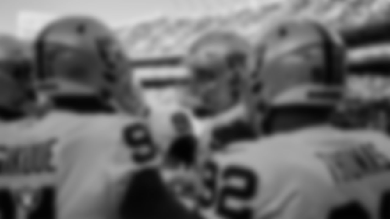 Las Vegas Raiders defensive end Maxx Crosby (98) talks to the defensive line in a huddle during warm ups before the regular season away game against the Kansas City Chiefs.