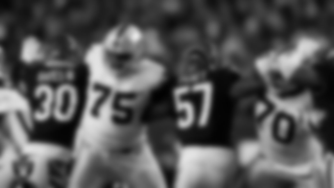 Las Vegas Raiders tackle Brandon Parker (75) and guard/tackle Alex Leatherwood (70) block during the postseason away game against the Cincinnati Bengals.