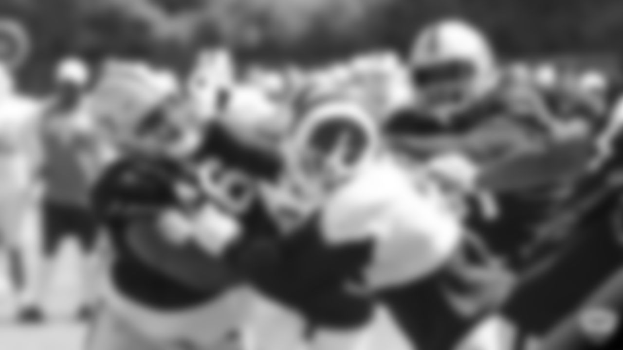 Raiders guard Gabe Jackson (66) and center Rodney Hudson (61) on the field for a joint practice with the Los Angeles Rams at 2019 Training Camp.