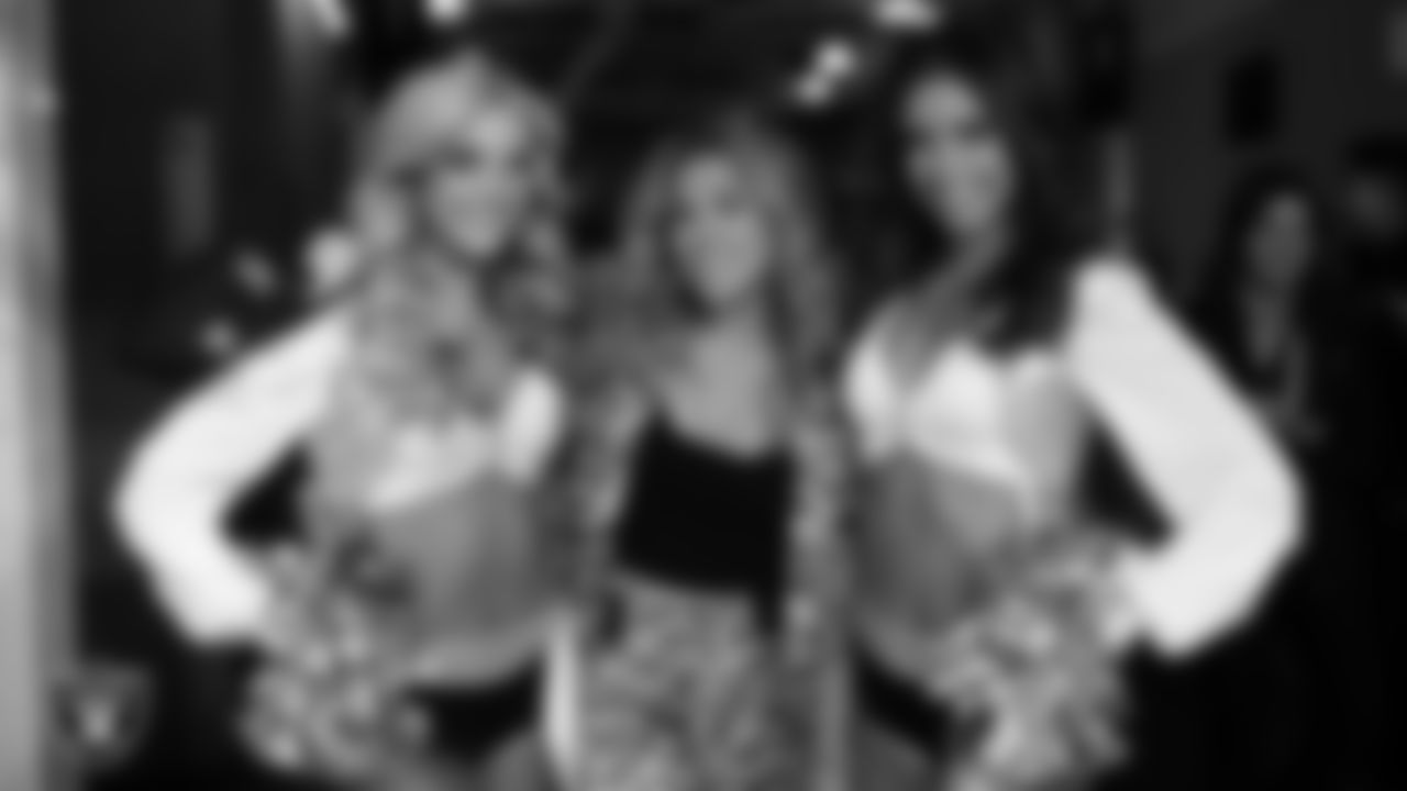 Raiderette Camryn and Maddie with singer, songwriter and author Rachel Platten before the regular season home game against the Houston Texans at Allegiant Stadium.