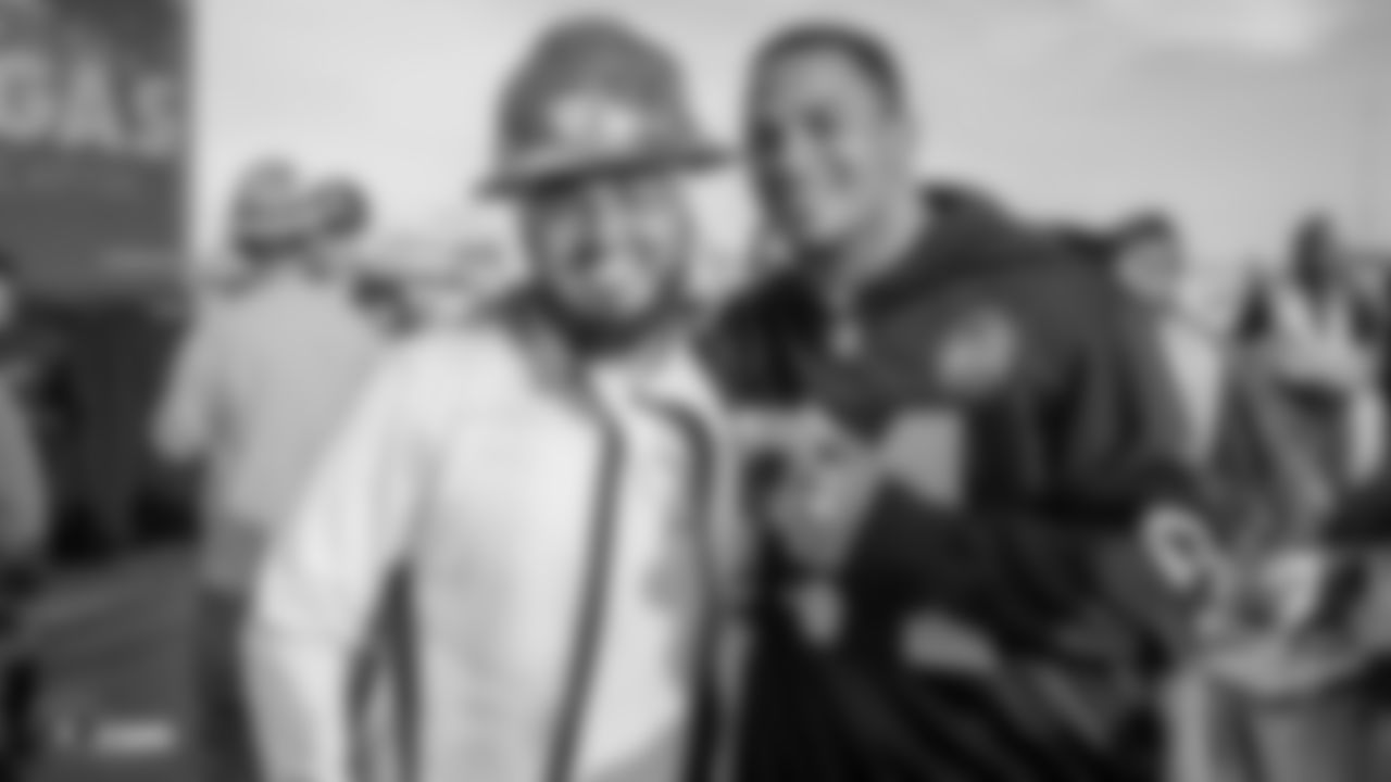 Raiders safety Johnathan Abram (24) poses for a photo with a construction worker following an official announcement of the Raiders changing their name to the Las Vegas Raiders.