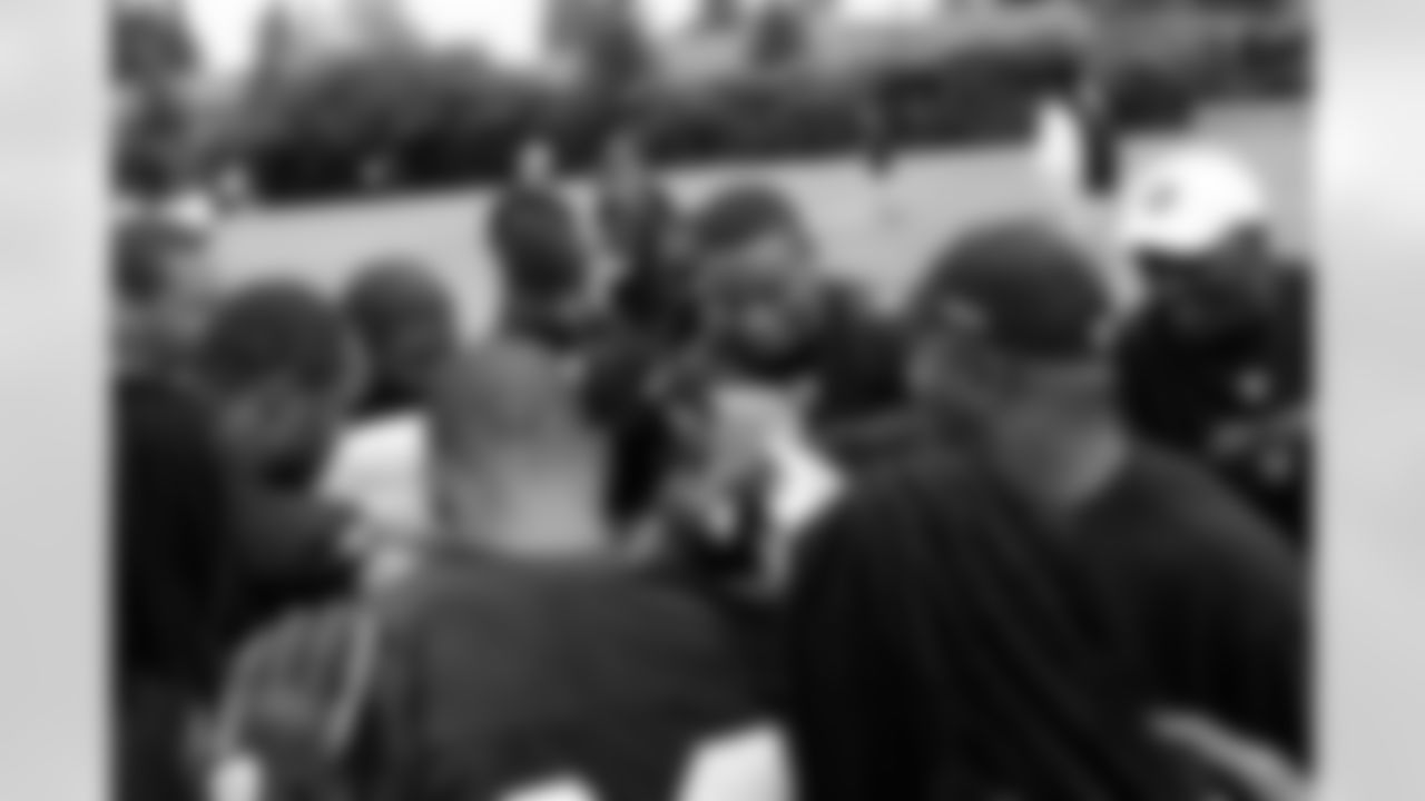 Oakland Raider defensive backs come together to end practice. Photo By Tony Gonzales