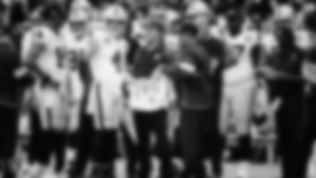 Raiders quarterback Derek Carr (4) talks with Head Coach Jon Gruden on the sidelines during the regular season game against the Los Angeles Chargers.