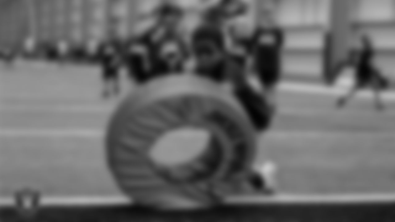 An athlete participates in a drill during the Raiders Play Football Skills Camp at Intermountain Health Performance Center.