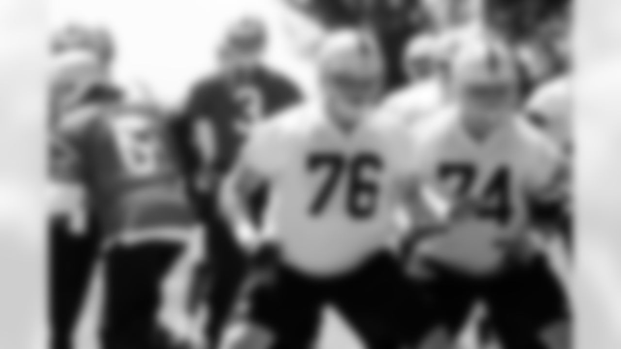 Offensive linemen Lucas Nix and Colin Miller block for QB Terrelle Pryor.