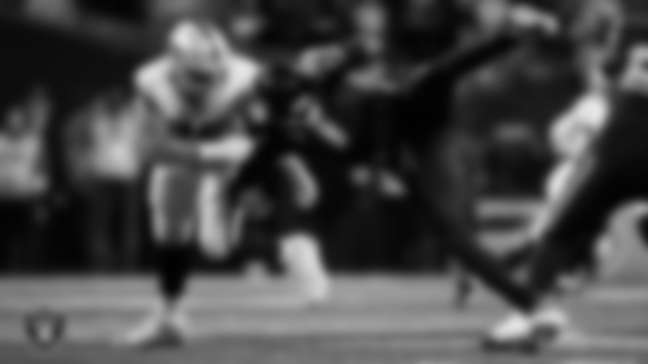 Las Vegas Raiders defensive end Maxx Crosby (98) knockdown the quarterback during the regular season away game against the Seattle Seahawks at Lumen Field.