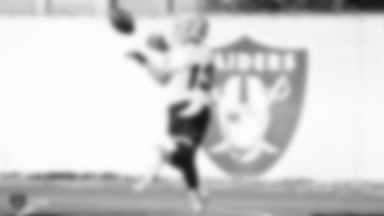 Raiders wide receiver Hunter Renfrow (13) goes for a catch during practice.