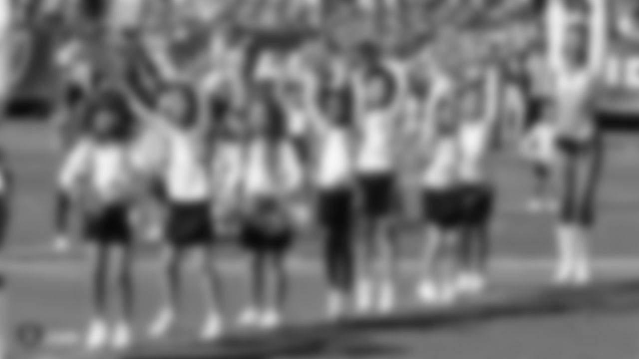 The Raiderettes and Junior Raiderettes perform on the field before the Raiders game against the Los Angeles Rams.