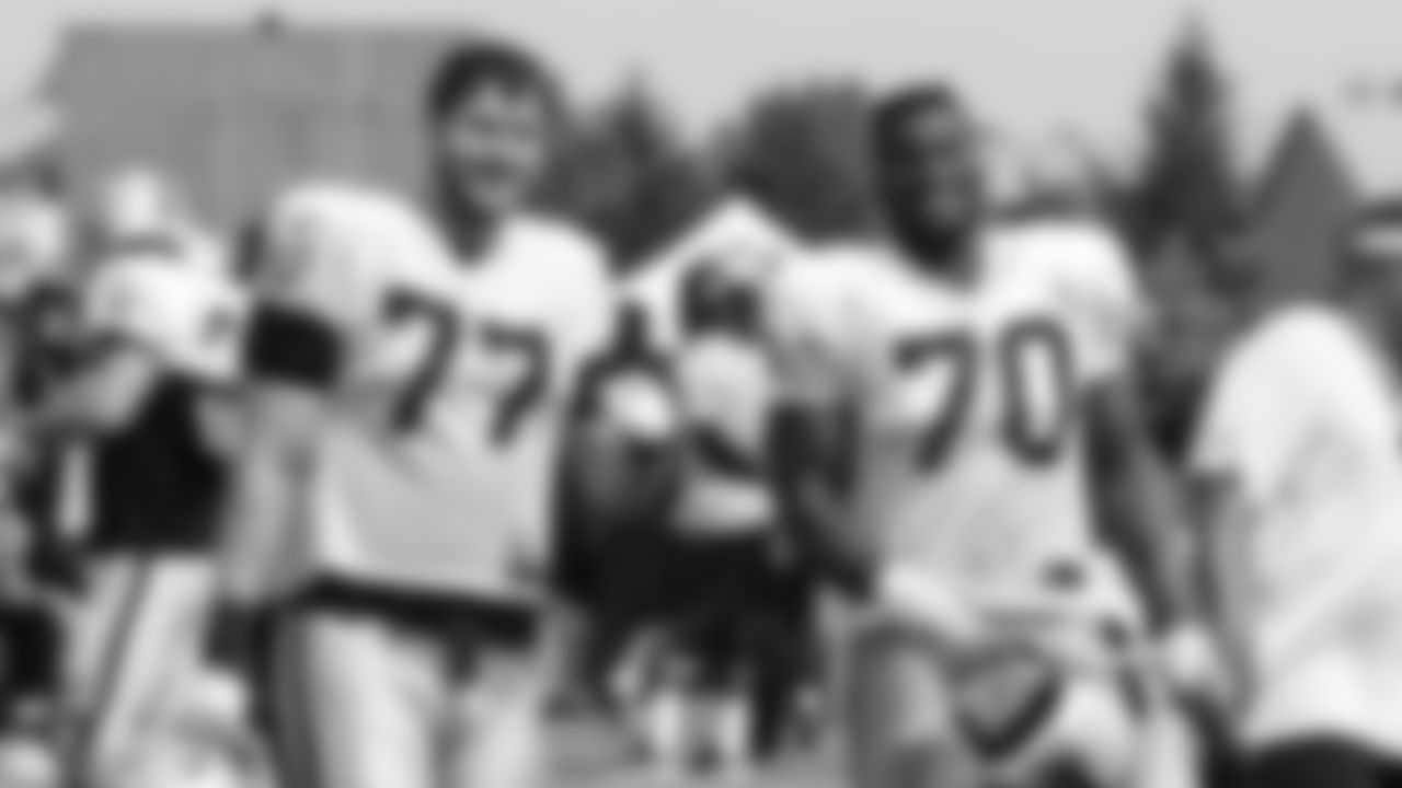 Oakland Raiders offensive tackle Kolton Miller (77) and offensive guard Kelechi Osemele (70) on the field for practice at 2018 Training Camp at The Oakland Raiders Napa Valley Training Complex, Friday, August 3, 2018, in Napa, California.