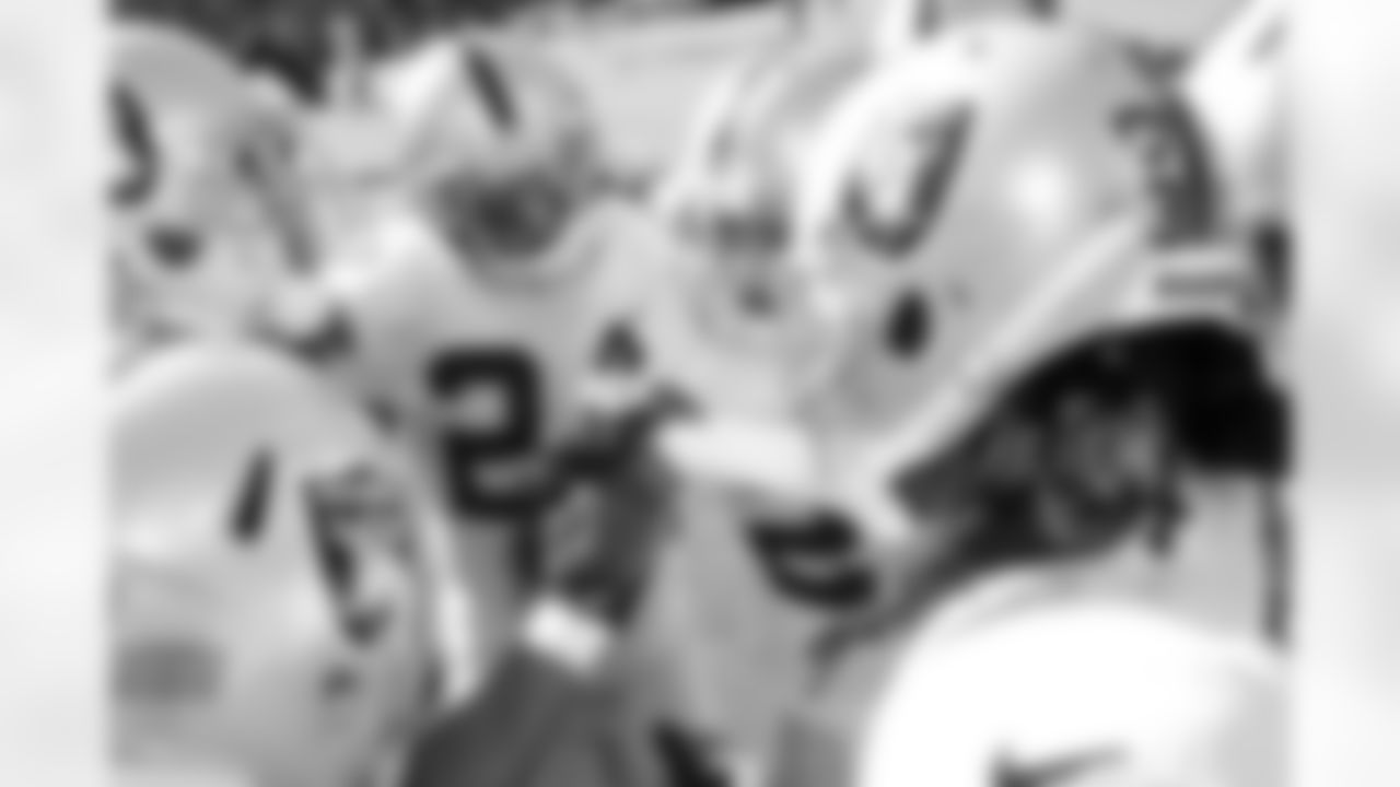The defensive backs huddle up.