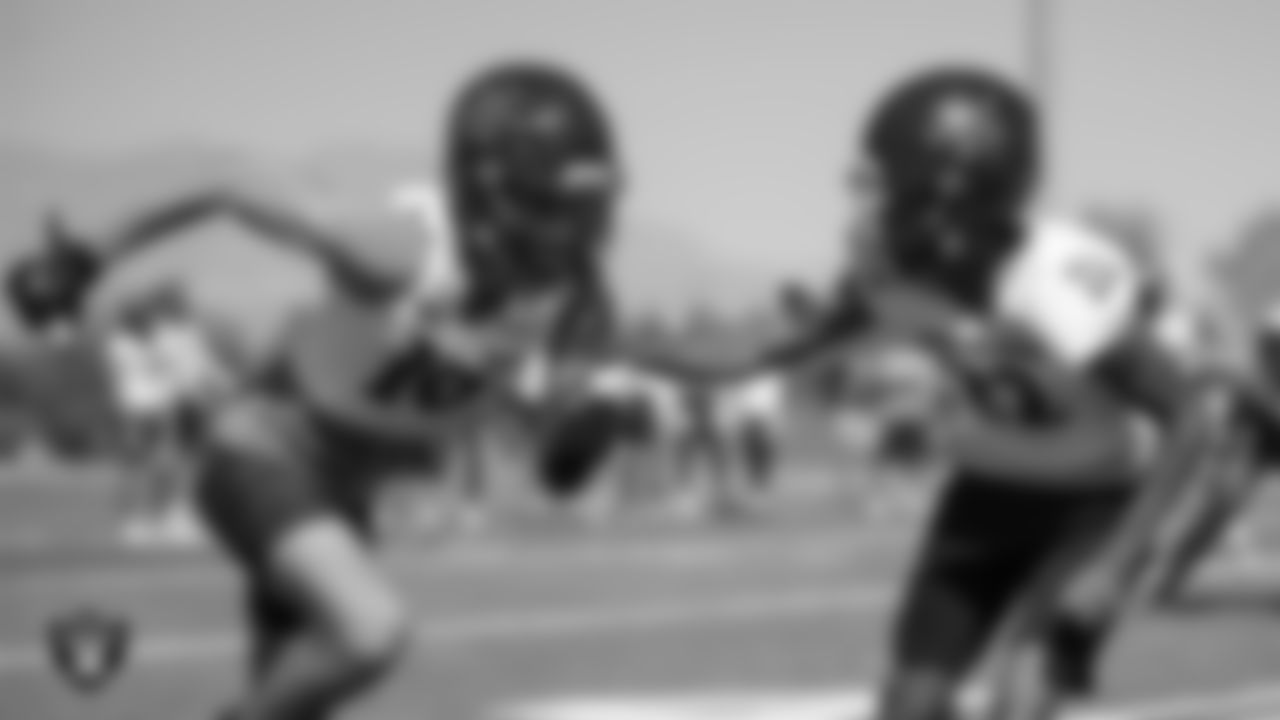 Members of the Arbor View High School football team go through a play during practice at Arbor View High School.