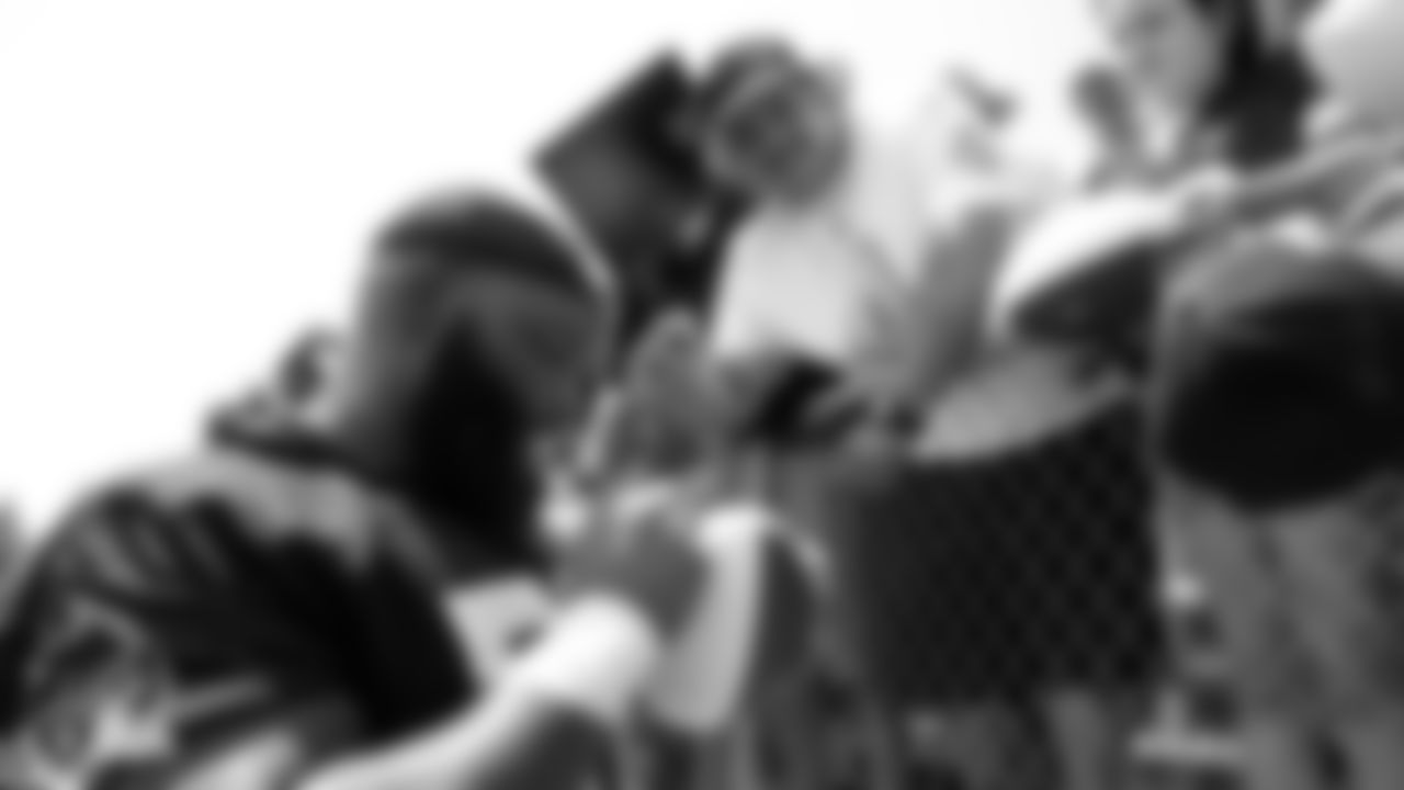 Oakland Raiders defensive tackle Justin Ellis (78) signs autographs for fans after practice at 2018 Training Camp at Memorial Stadium, Saturday, July 28, 2018, in Napa, California.
