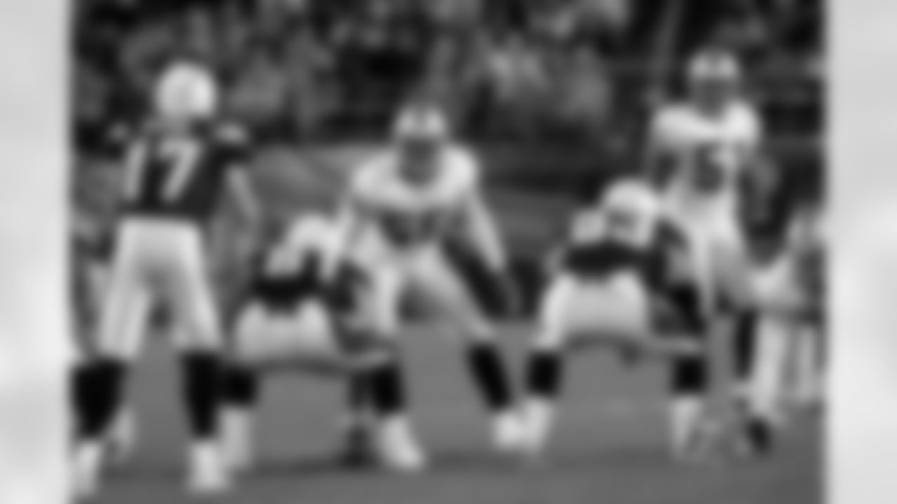 The linebackers set at the line of scrimmage.