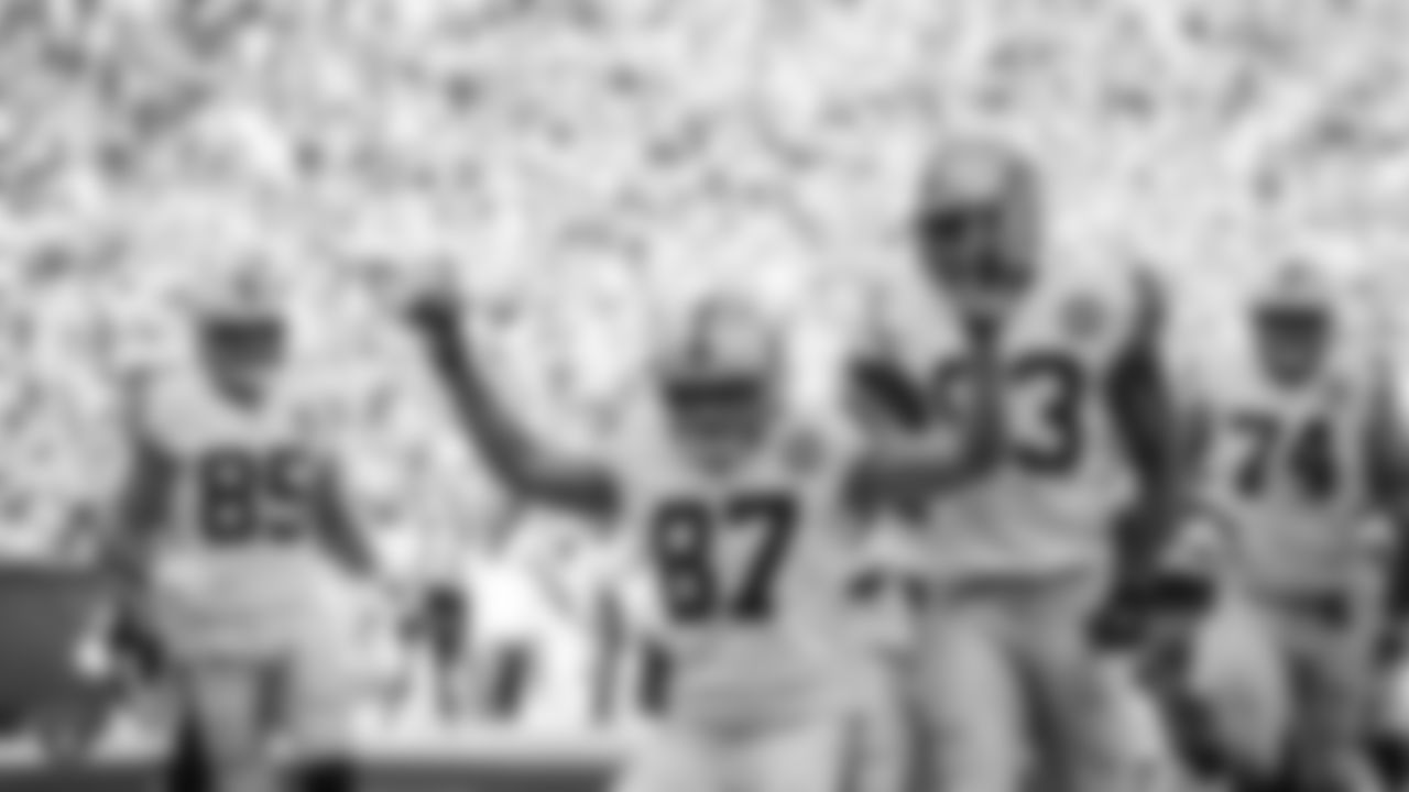 Raiders tight end Foster Moreau (87) celebrates after scoring on a 10-yard touchdown catch during the regular season game against the Green Bay Packers.