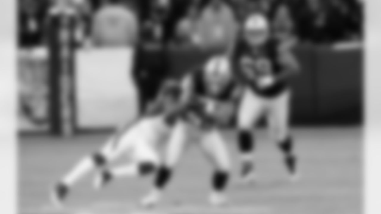 WR Nick Miller protects the football from the Cardinals defender.